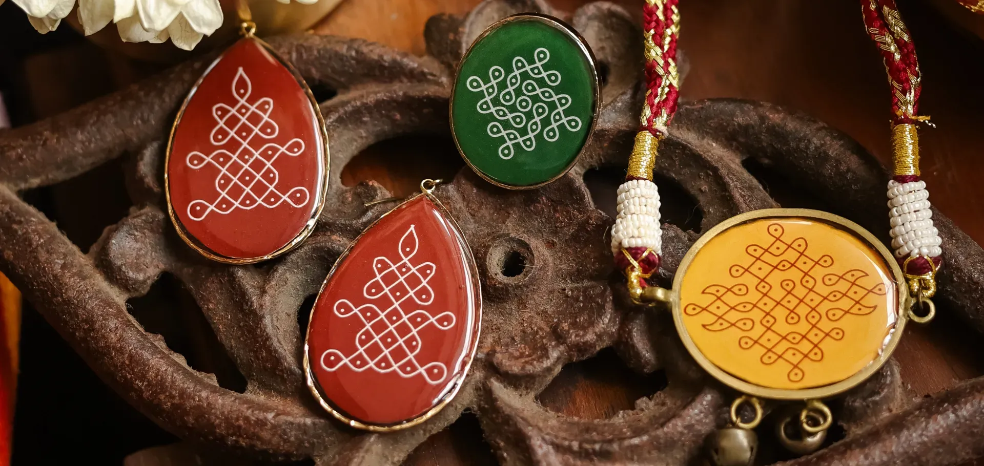 Kolam-patterned resin jewellery handcrafted by Alankaara