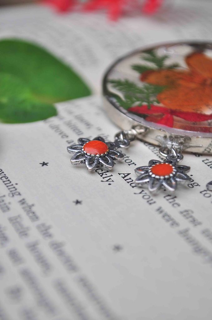 Fiery Ixora and Nasturtium Badge of Honour with Saffron Enamel - A Symbol of Conquest and Fight